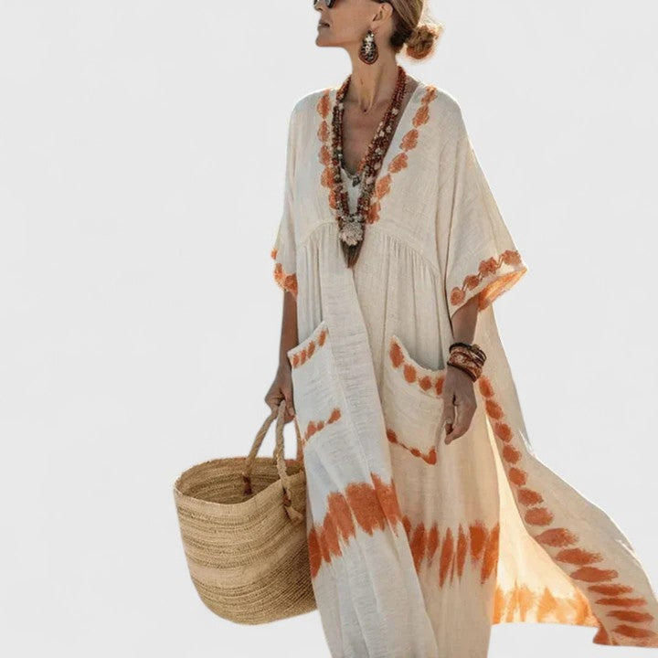 Flowy boho maxi dress for women, featuring a flattering V-neck and stylish stripes. Comfortable loose fit.