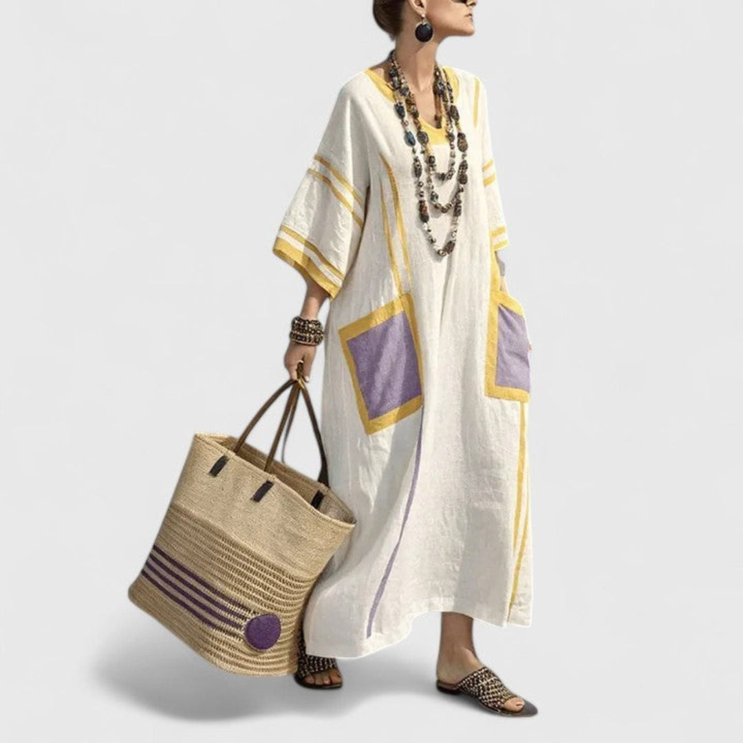 Women's summer striped maxi dress with pockets. V-neck boho kaftan style offers loose comfort for vacation.