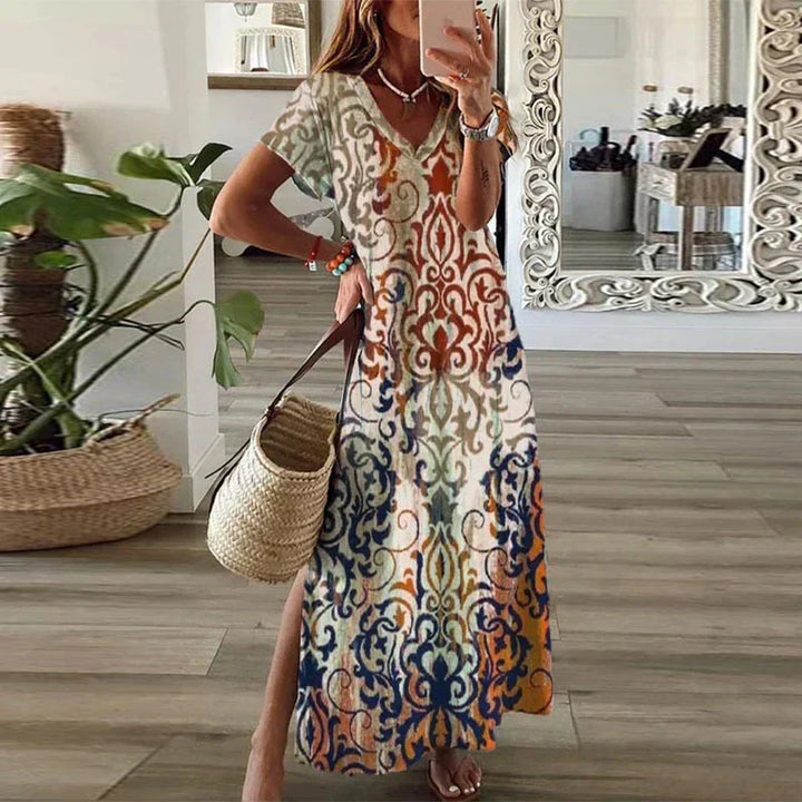Women's boho maxi dress with short sleeves, V-neck, and vibrant paisley print, perfect for summer casual wear.