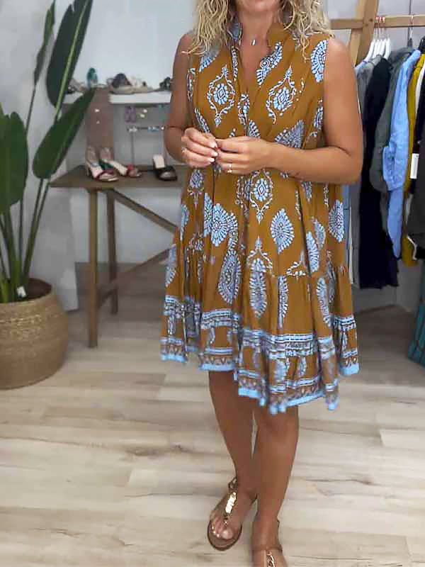 Casual women's summer mini dress with a bohemian medallion print, comfortable smock fit and sleeveless style.
