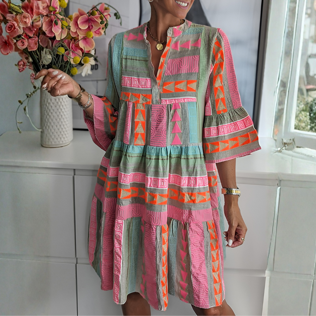 Women's boho midi dress with geometric print, loose fit, V-neck & three-quarter sleeves. Perfect for summer casual chic.