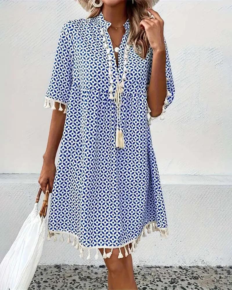 Relaxed fit women's summer mini dress, featuring a chic tassel trim. Ideal for beachwear & vacations.
