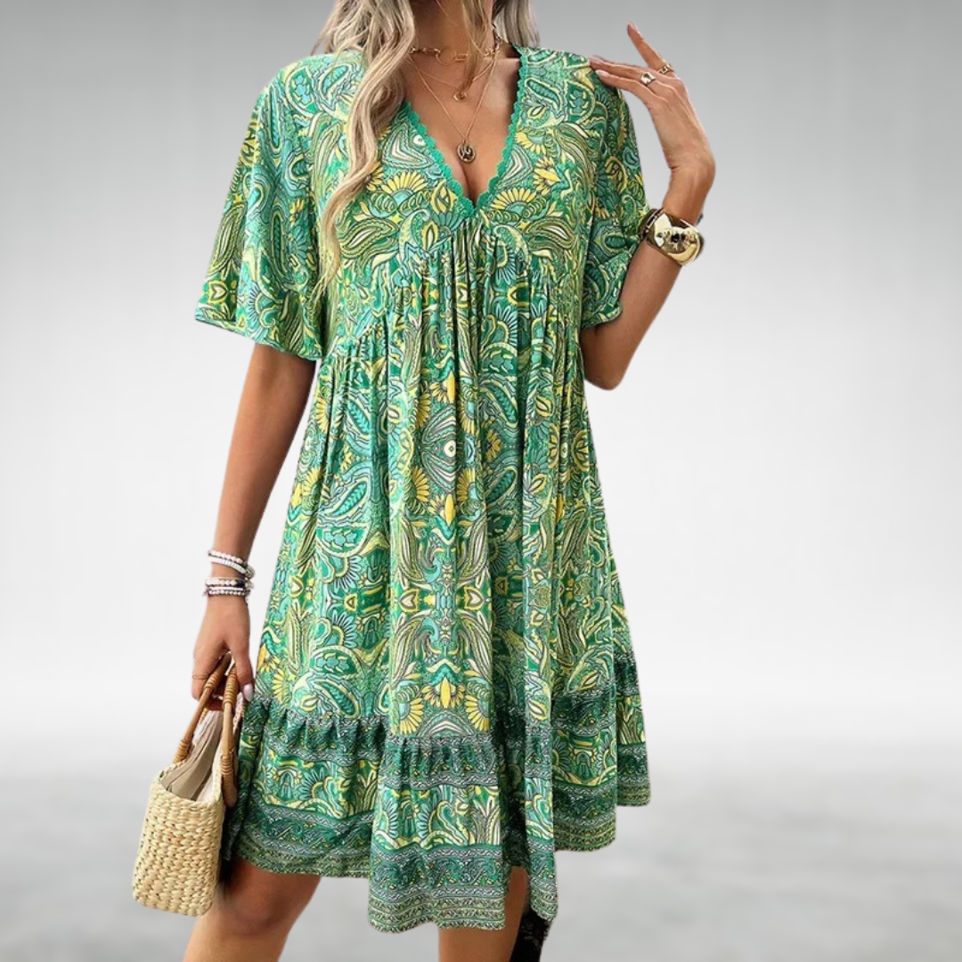 Flowy women's short sleeve mini dress, vibrant boho paisley print. Perfect summer fashion for casual outings & vacations.