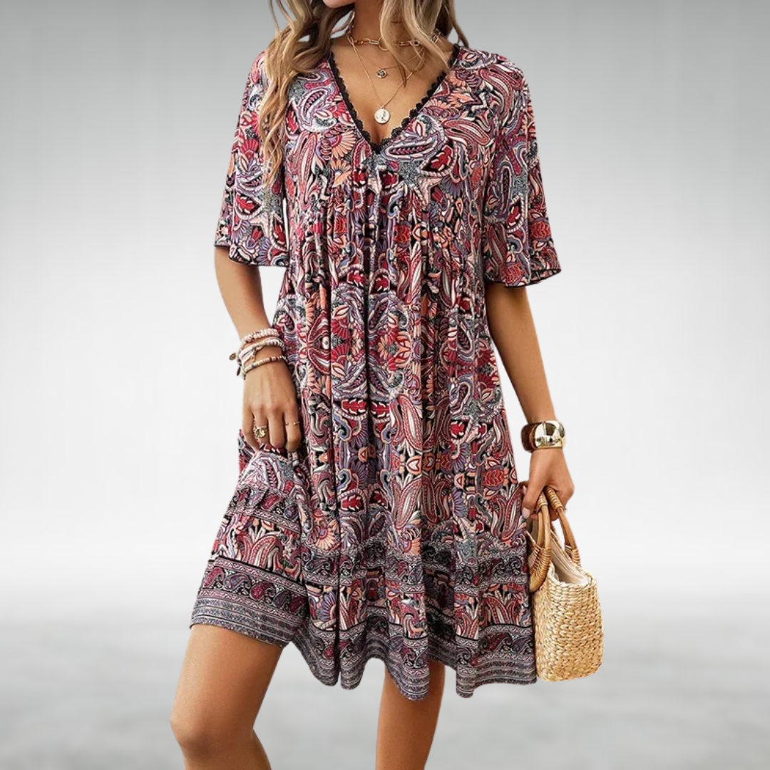 Vibrant women's short-sleeve boho mini dress with an eye-catching paisley print, great for summer casual & vacation.
