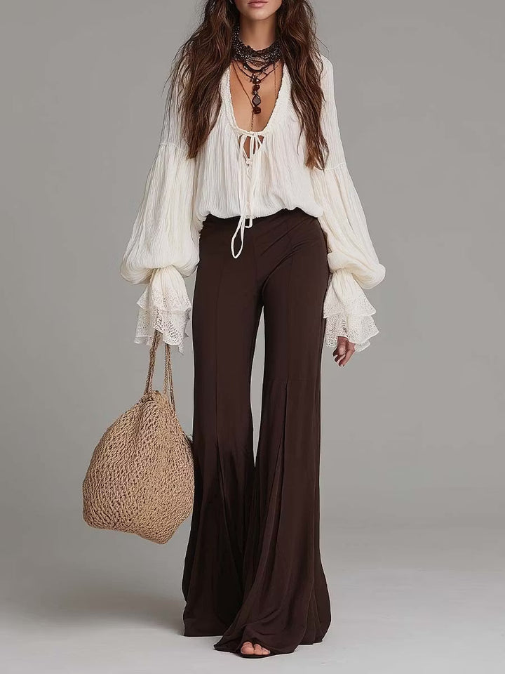 Women's boho two-piece set featuring a lace-up blouse and wide-leg pants, ideal for summer or festival wear.