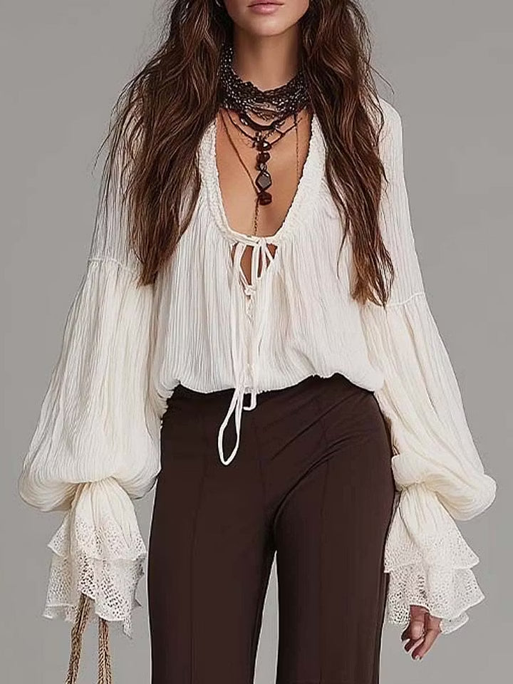 Bohemian chic women's matching set with a lace-up top and flowy wide-leg pants, perfect for beach or summer style.