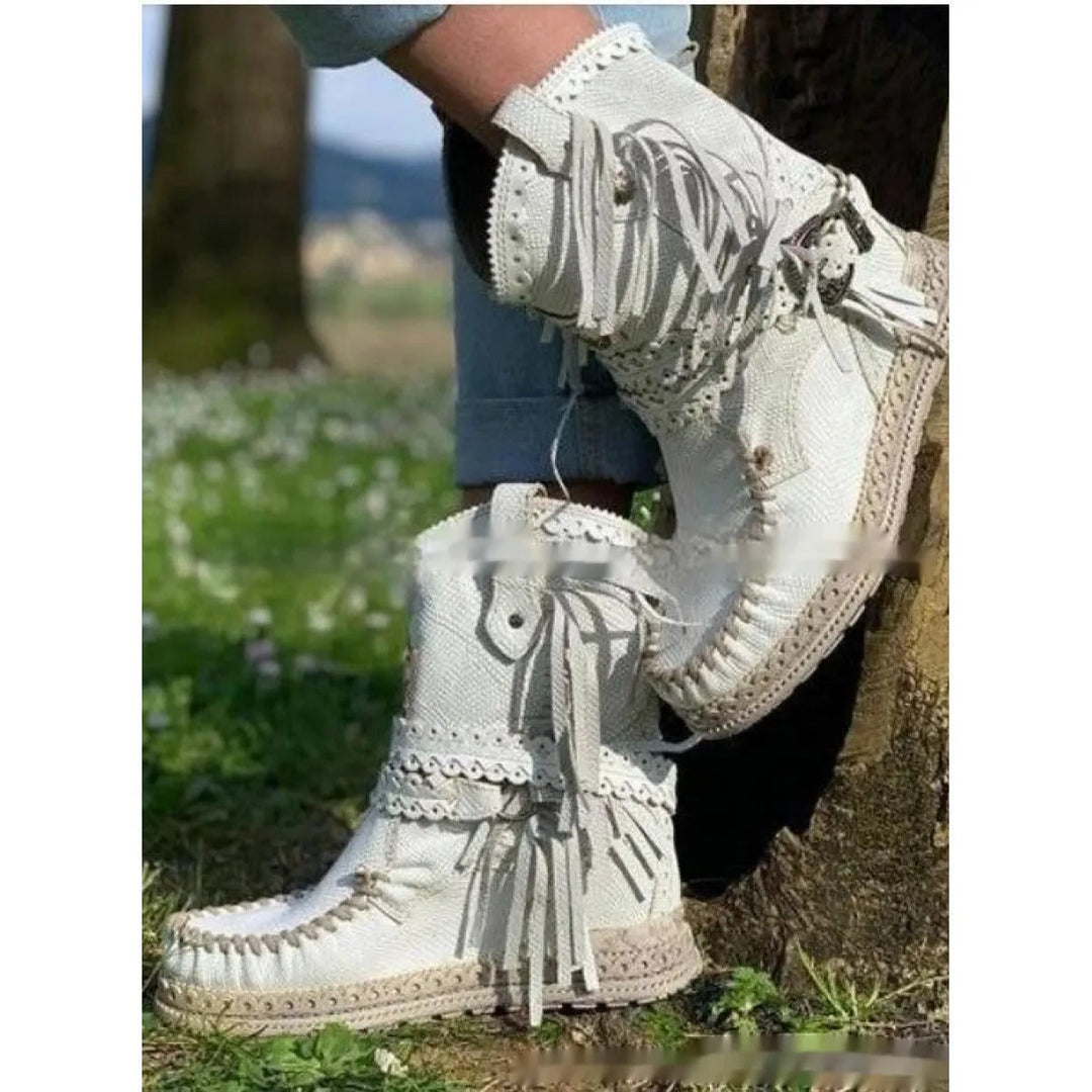 Women's casual boho ankle boots with western fringe detailing. Flat heel, slip-on comfort for everyday or travel.
