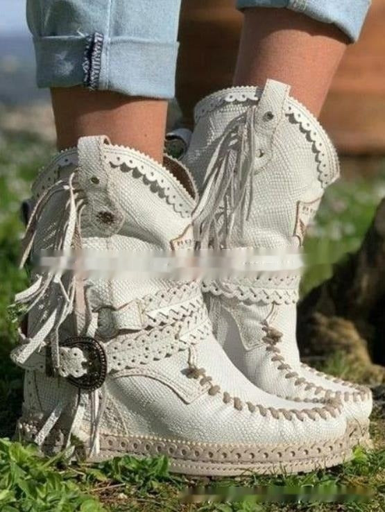 Stylish women's boho western fringe ankle boots. Flat heel, round toe, and comfortable slip-on design for any occasion.