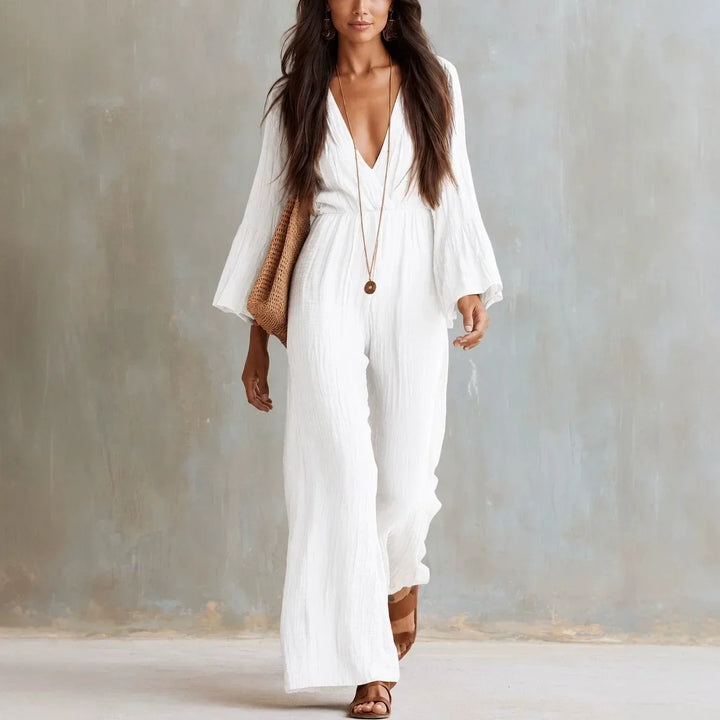 Women's boho wide-leg jumpsuit with deep V-neck & flare sleeves. Chic summer and vacation wear.