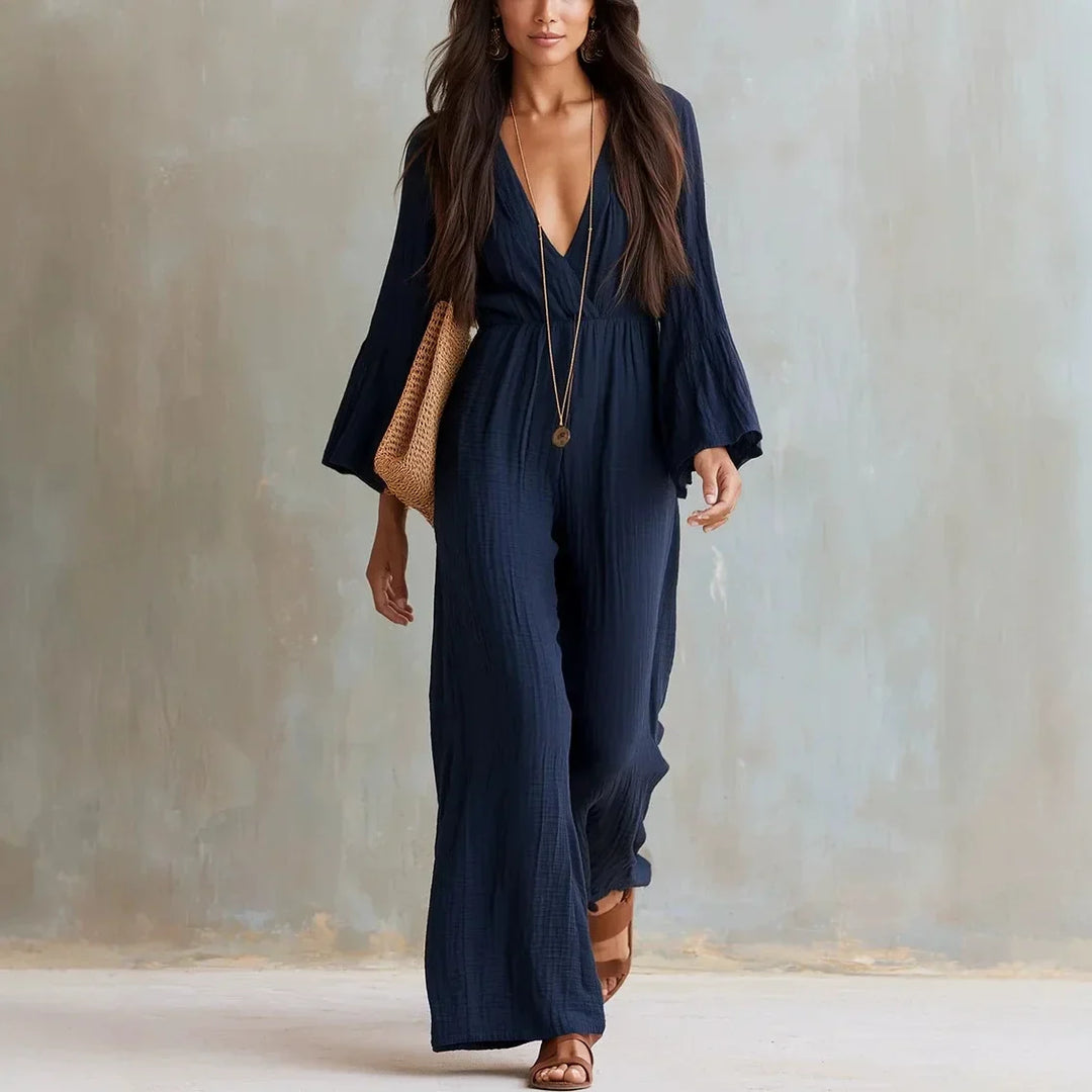 Elegant women's boho wide-leg jumpsuit, deep V-neck and flare sleeves. Comfortable & versatile for casual chic.
