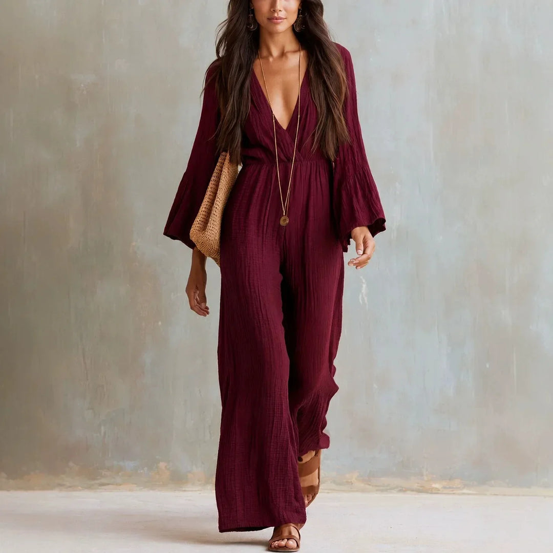 Stylish women's wide-leg jumpsuit, boho style with deep V-neck and trendy flare sleeves. Perfect for summer.