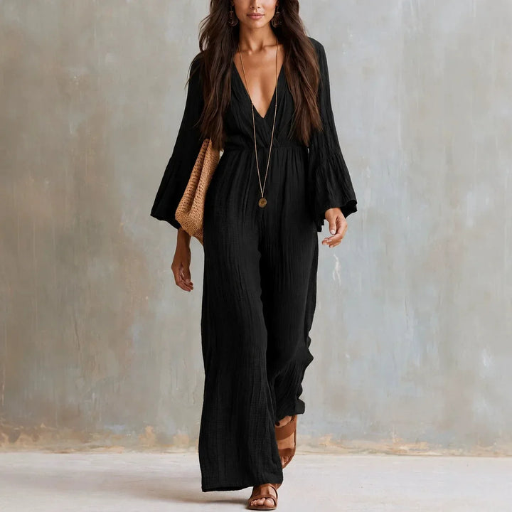 Comfortable women's boho jumpsuit featuring wide-legs, deep V-neck, and flare sleeves for a relaxed look.
