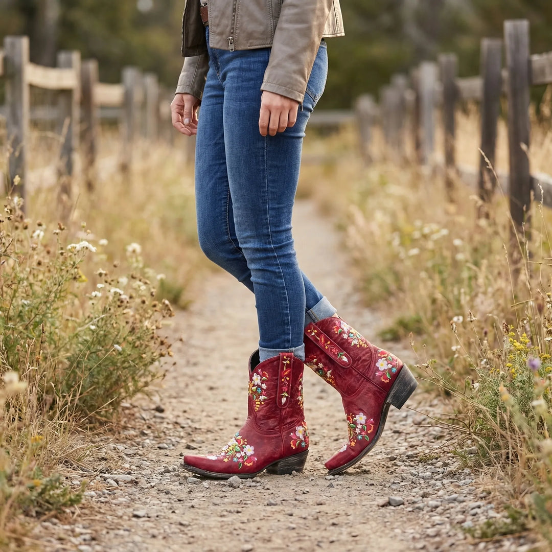 Women's bold floral embroidered western ankle boots, unique statement footwear.