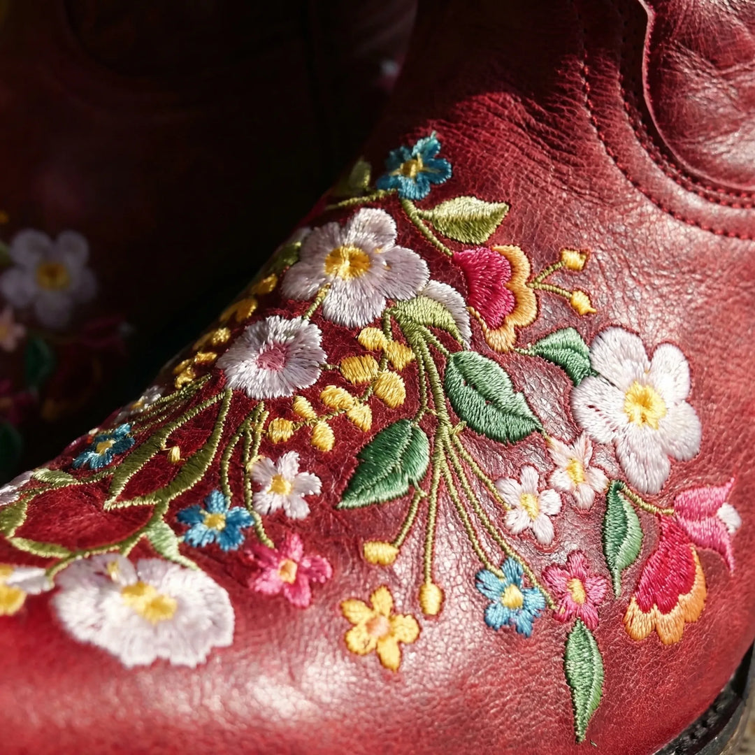 Stylish black floral embroidered western ankle boots for women, comfortable outdoor fashion.