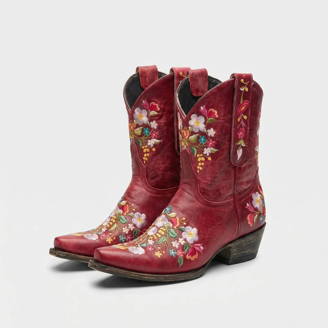 Brown women's western ankle boots with vibrant floral embroidery, unique statement footwear.