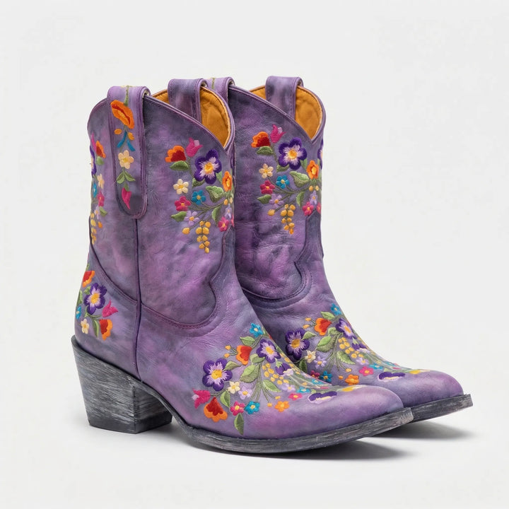 Women's cowboy ankle boots with elegant floral embroidery, perfect for a unique look.