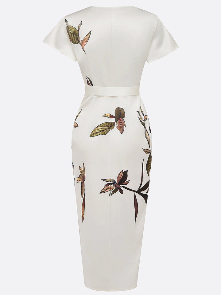 Women's V-neck wrap midi dress in a vibrant botanical print, featuring flutter sleeves and a flattering tie waist for weddings.