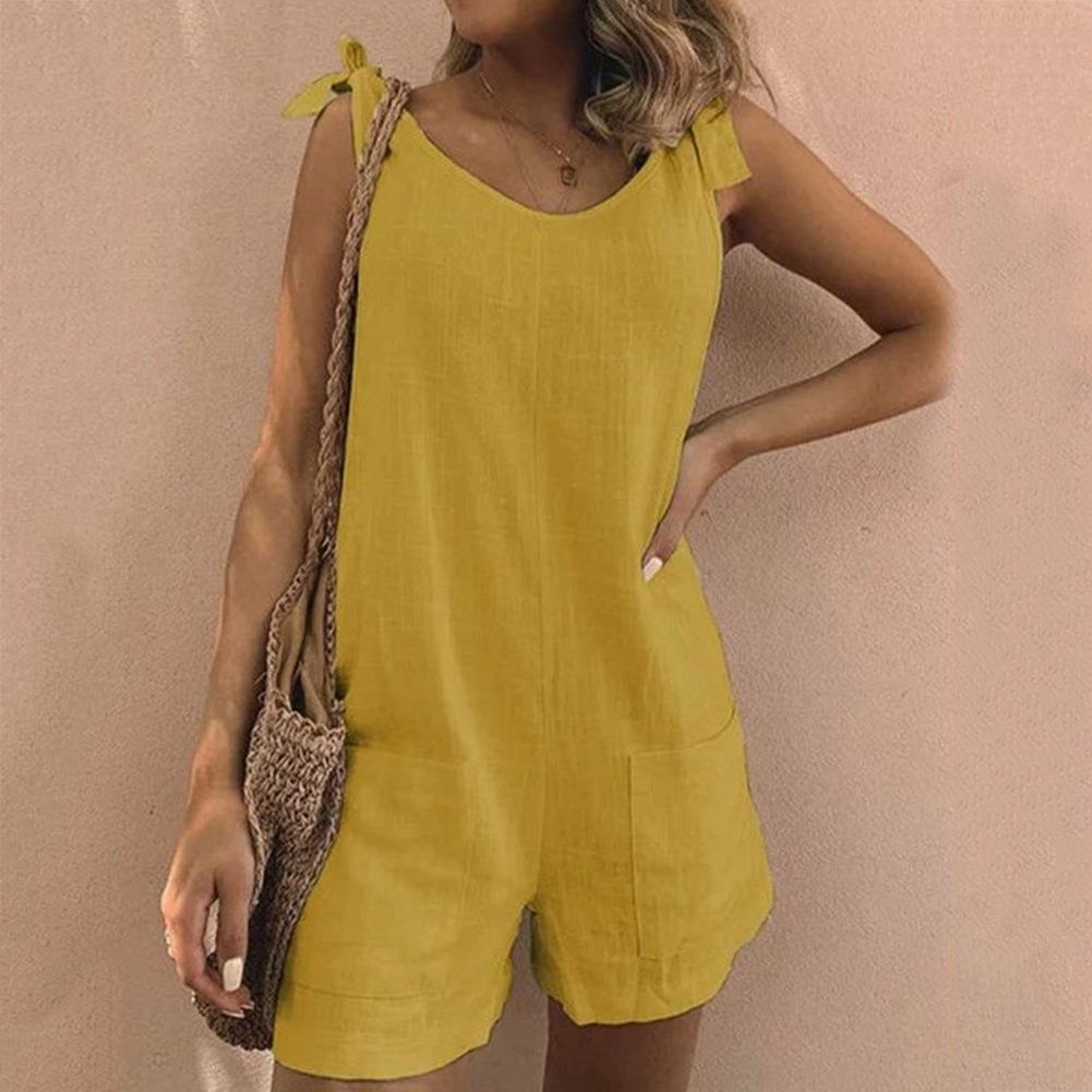 Stylish one-piece playsuit with a chic bow strap design and convenient pockets, perfect for summer outings.