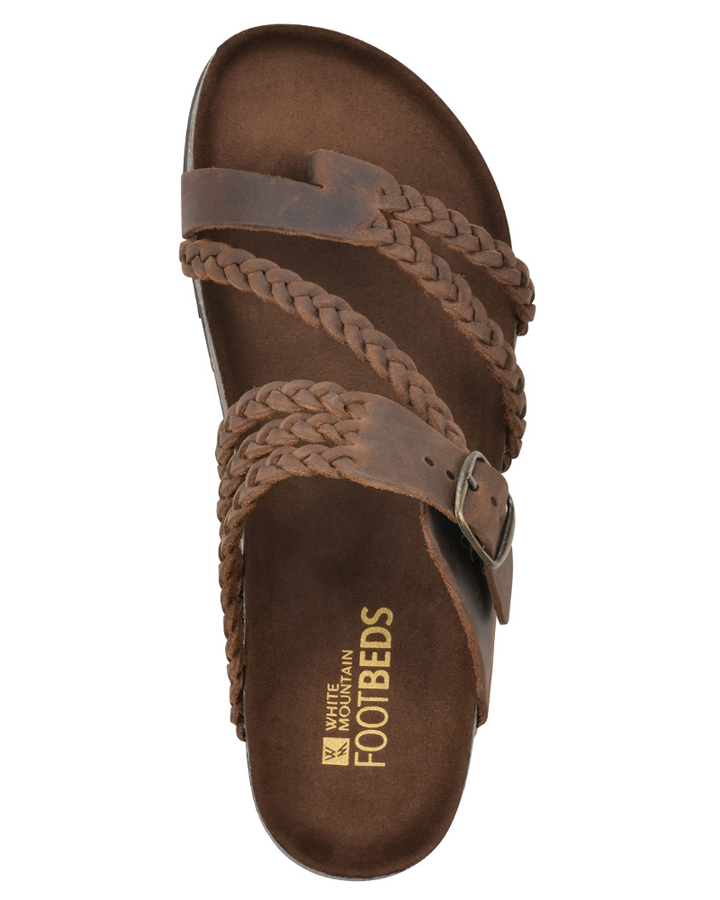 Chic women's sandals featuring intricate braided thong straps & a supportive contoured comfort sole.