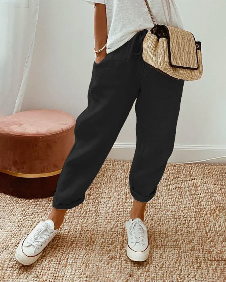 Woman wearing chic, versatile comfort pants for a relaxed yet stylish casual outing.