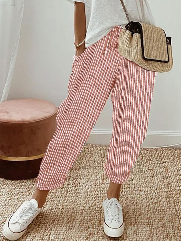 Detail of elastic waistband and functional pockets on women's comfort pants for ultimate wear.