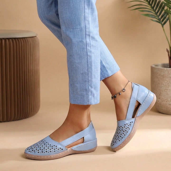 Stylish women's slip-on loafers with a breathable cutout design, ideal for everyday fashion & comfort.