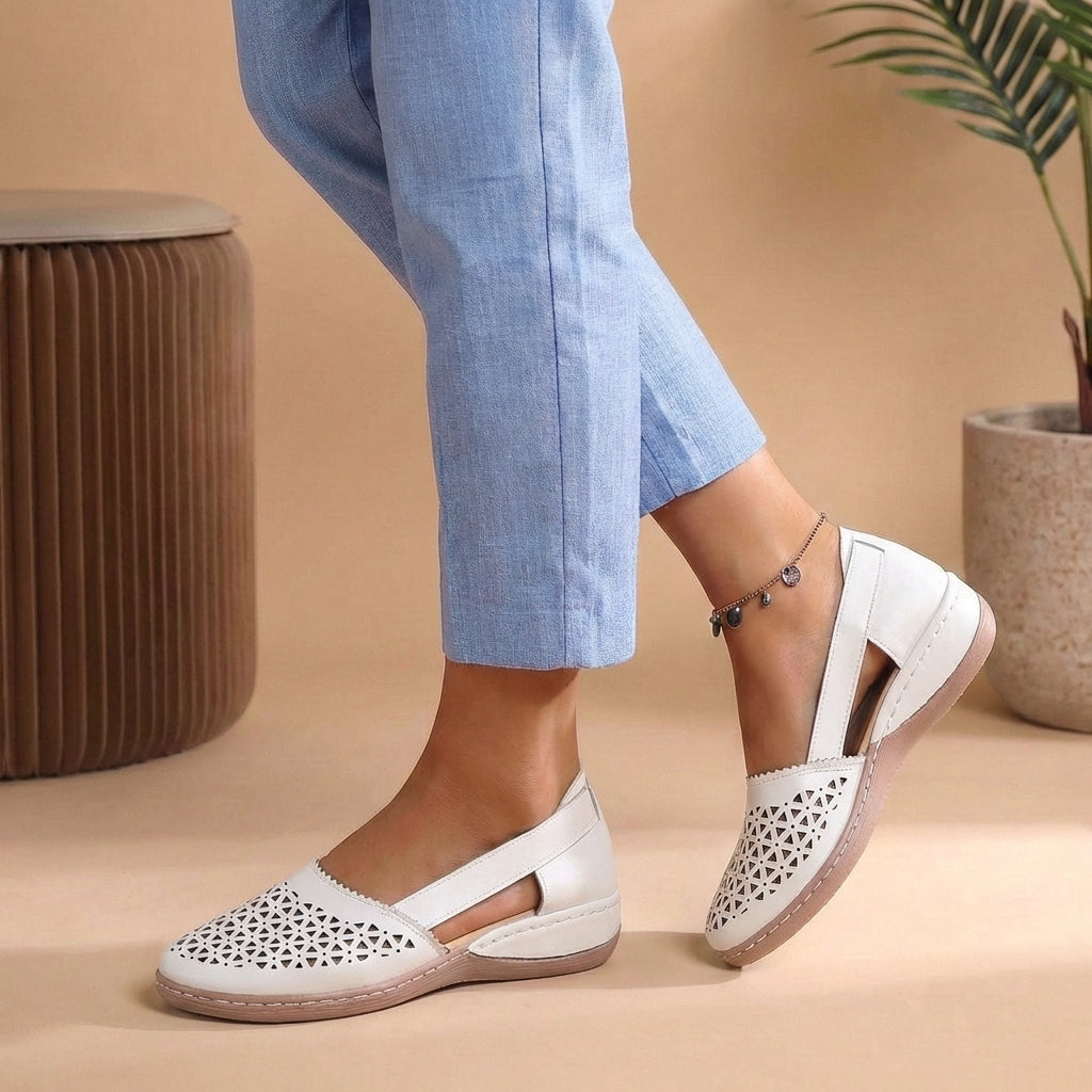 Breathable women's slip-on loafers with a stylish cutout, ensuring cool comfort for spring/summer casual wear.