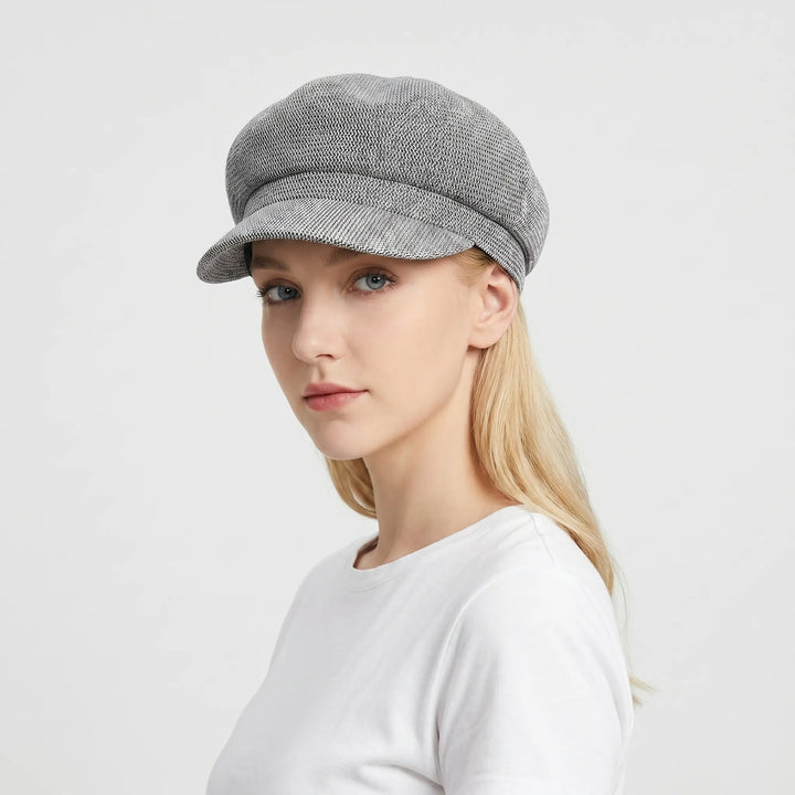 Elegant women's summer sun hat. Breathable fabric keeps you cool. Ideal for travel & beach outings. UV protection.