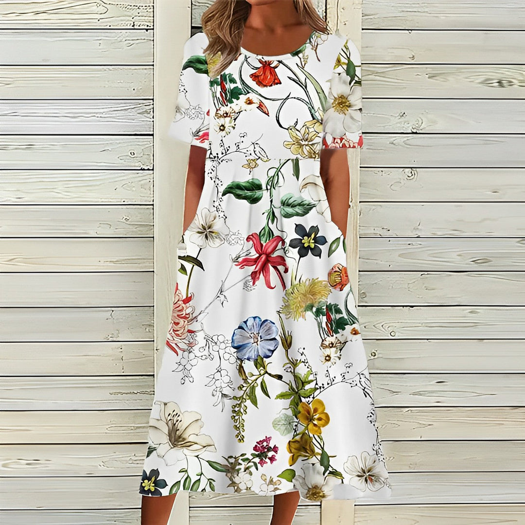 Women's breezy floral midi dress, perfect for summer. Effortless style with comfortable, elegant floral print.