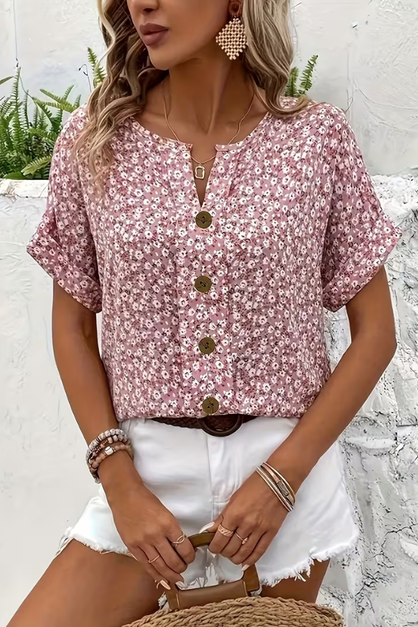 Printed floral women's blouse, a short-sleeve summer top. Versatile and breezy for casual wear or effortless everyday style.