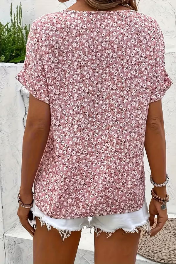 Women's short-sleeve floral summer blouse. Breezy, relaxed fit, lightweight, and printed for effortless casual elegance.