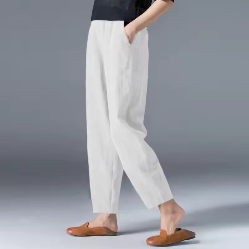 Women's breathable travel pants, relaxed fit, elastic waist for comfortable all-day wear.