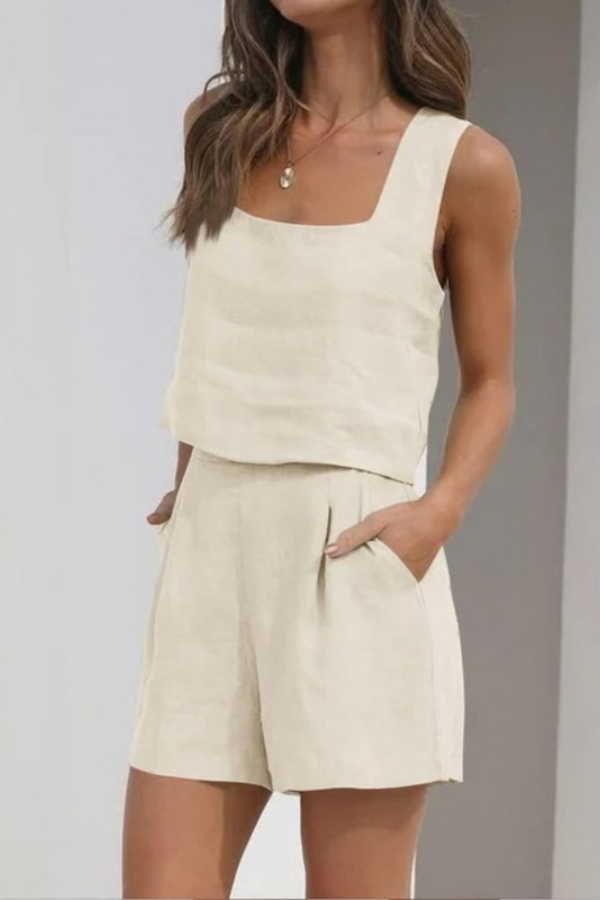Stylish apricot two-piece shorts set for women. Perfect vacation outfit, relaxed beachwear, sleeveless top.