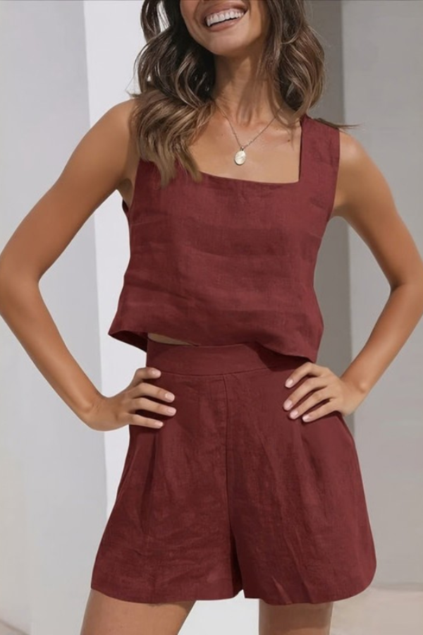Chic apricot women's two-piece set featuring a sleeveless top & matching shorts. Perfect for summer vacations.