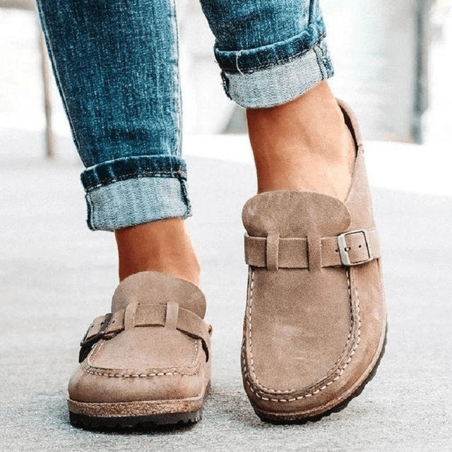 Women's Brynn orthopedic mules. Slip-on design for easy wear, featuring arch support & cushioned comfort.