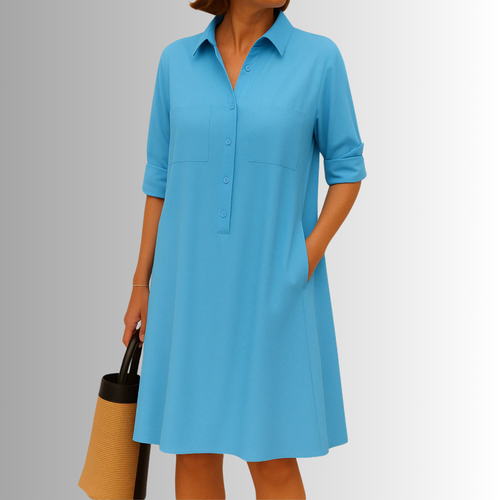 Casual & elegant women's button-down A-line dress with short sleeves, collared neckline, and pockets.