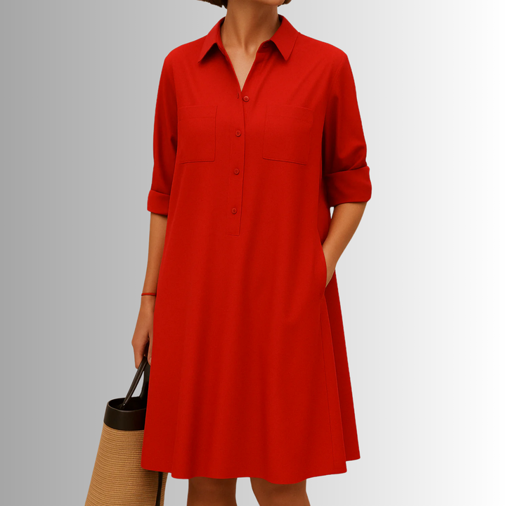 Collared, short sleeve A-line dress for women, featuring a full button-down front and functional pockets.