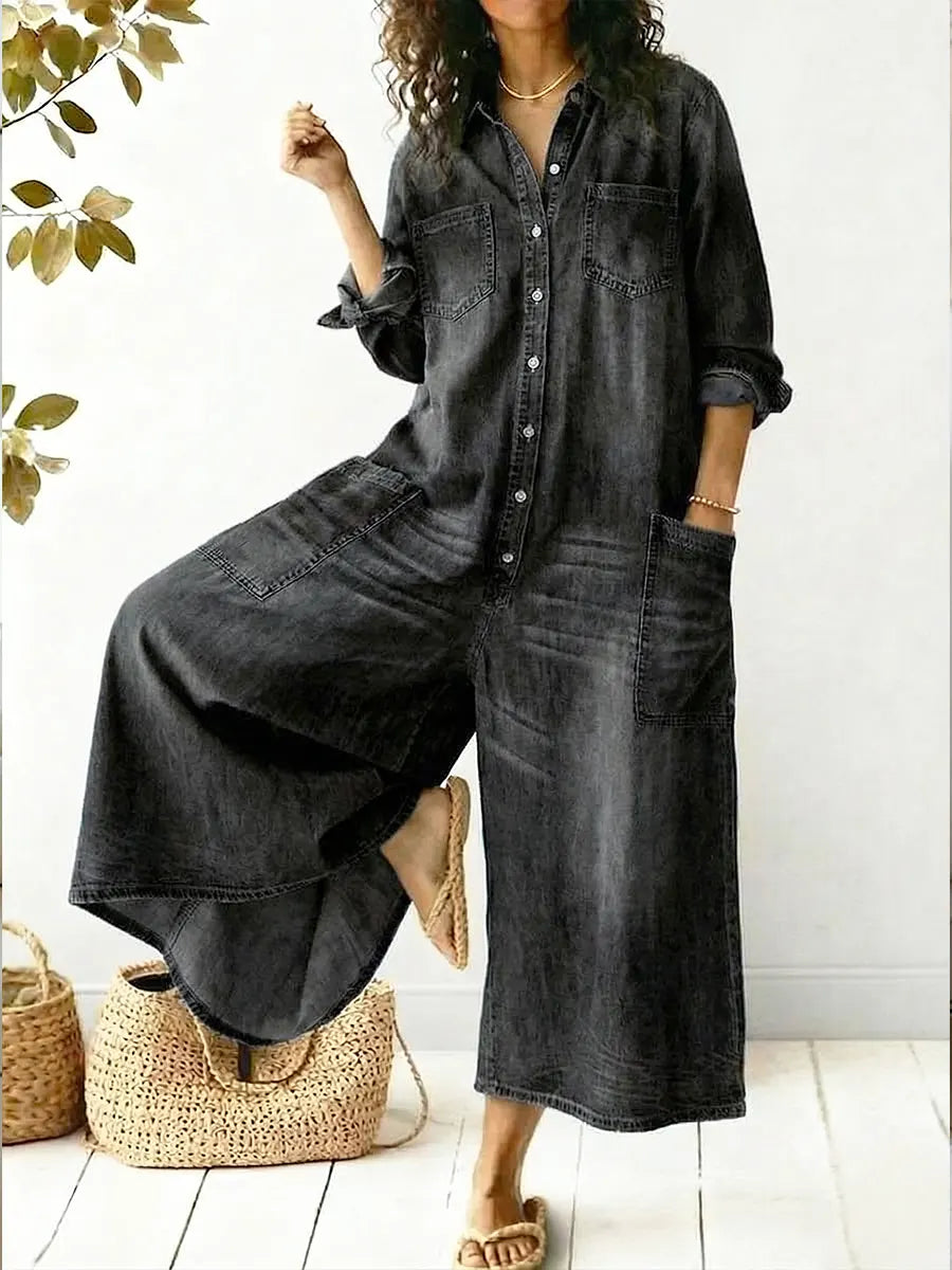 Relaxed fit women's wide leg jumpsuit, button-up, collared, long sleeves. Ideal for stylish comfort.
