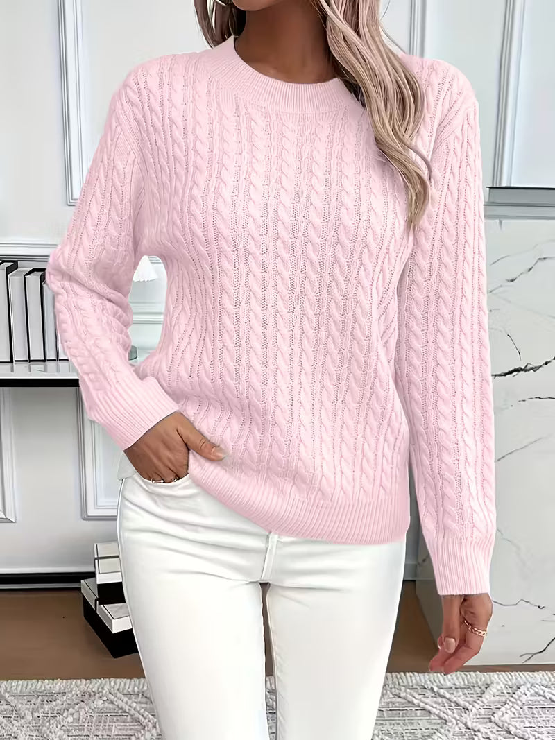 Elegant women's classic cable knit crew neck sweater, essential for timeless autumn style & warmth.