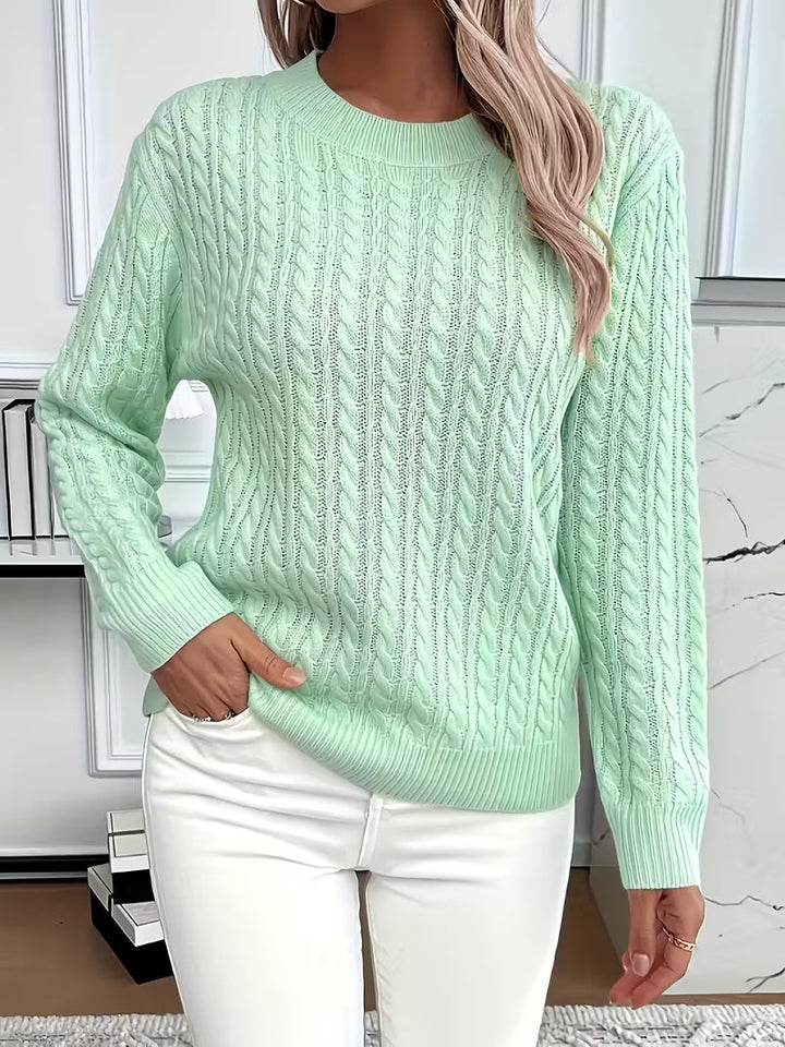 Effortless autumn style: women's long-sleeve cable knit crew neck sweater for versatile casual wear.
