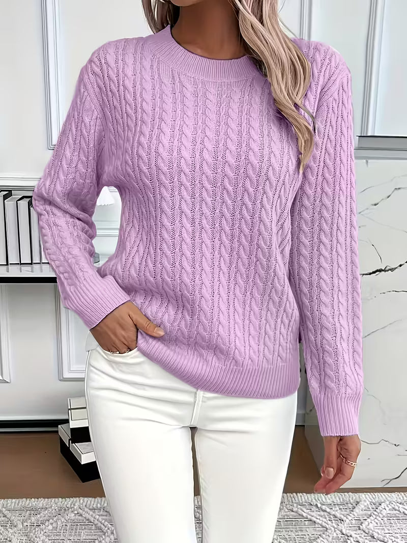 Classic women's cable knit crew neck sweater, a timeless autumn fashion staple for casual elegance.