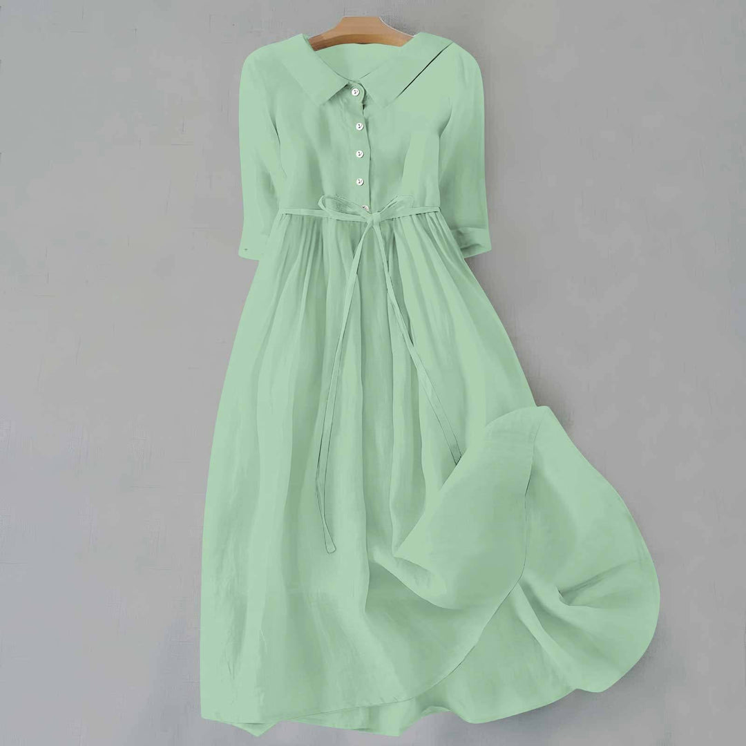 Chic women's casual A-line midi dress with short sleeves, great for comfortable spring and summer fashion.