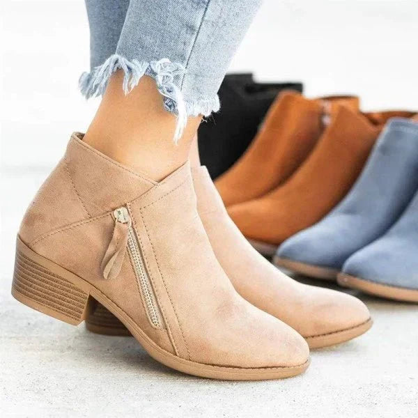Stylish black women's ankle boots with a practical side zip and sturdy block heel, perfect for casual wear.