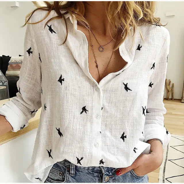 Charming bird print long sleeve women's button-up blouse. Collared, relaxed fit, perfect casual top for spring fashion.