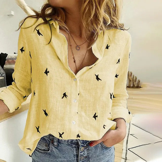 Stylish women's printed button-up blouse featuring a unique bird pattern. Long sleeve, relaxed fit for versatile casual wear.