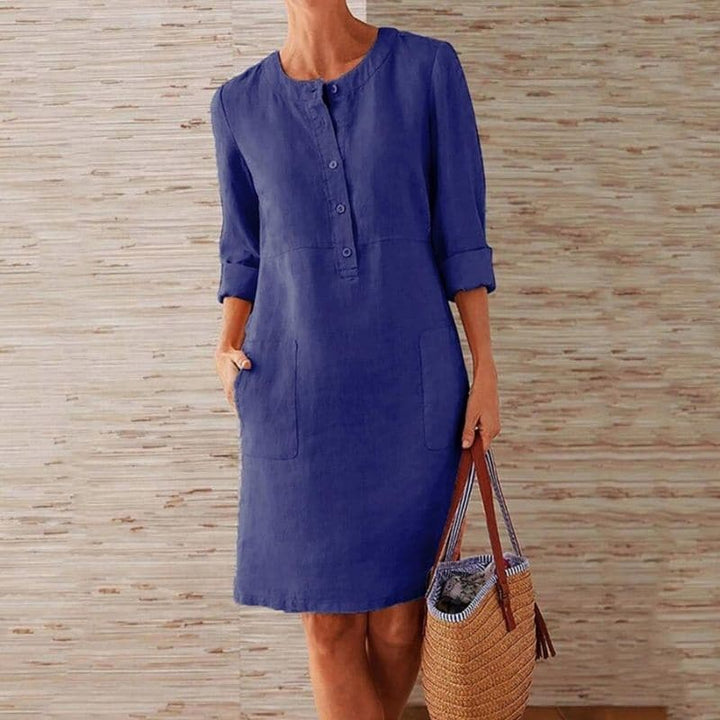 Women's casual button front midi shift dress with pockets. Relaxed fit for comfortable everyday spring & summer wear.
