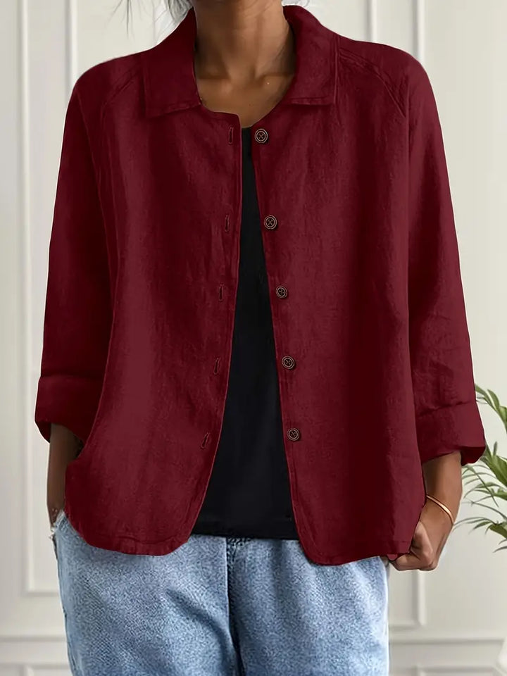 Effortless women's casual button-front top, relaxed fit, three-quarter sleeve for versatile comfort wear.