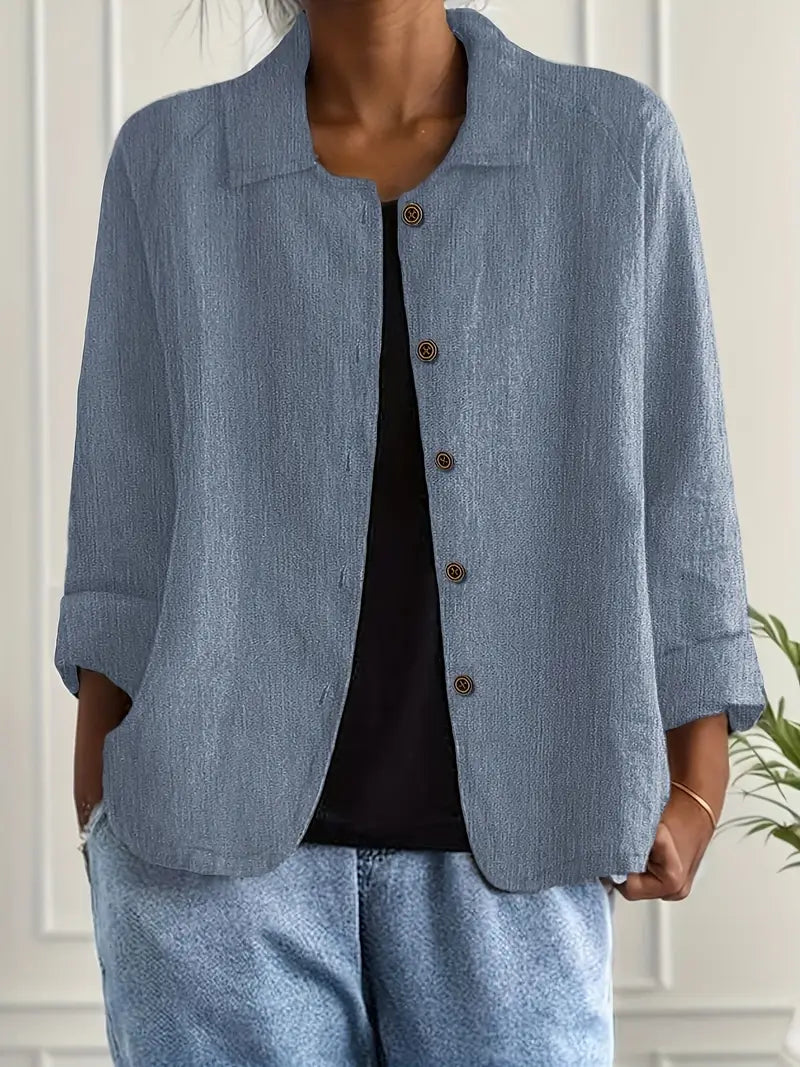 Classic women's button-front collared shirt, relaxed fit, three-quarter sleeve for versatile style.