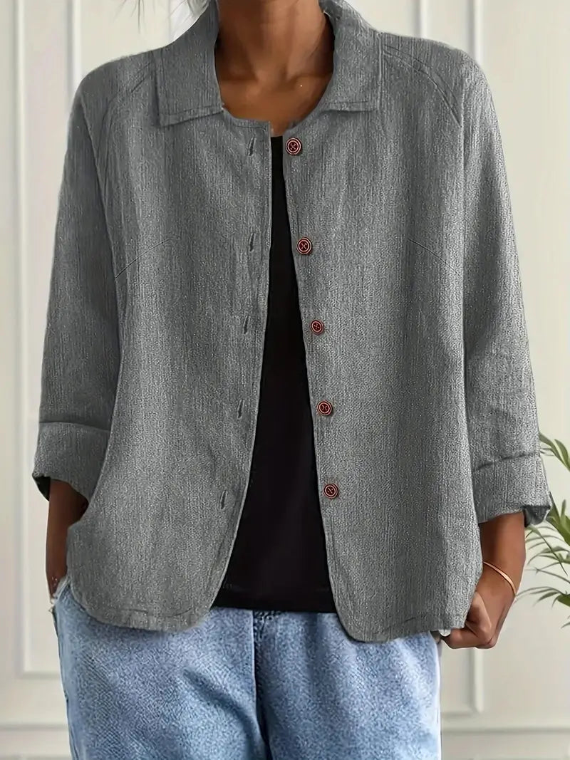 Stylish women's casual button-front top, relaxed fit, three-quarter sleeves, ideal for everyday comfort.