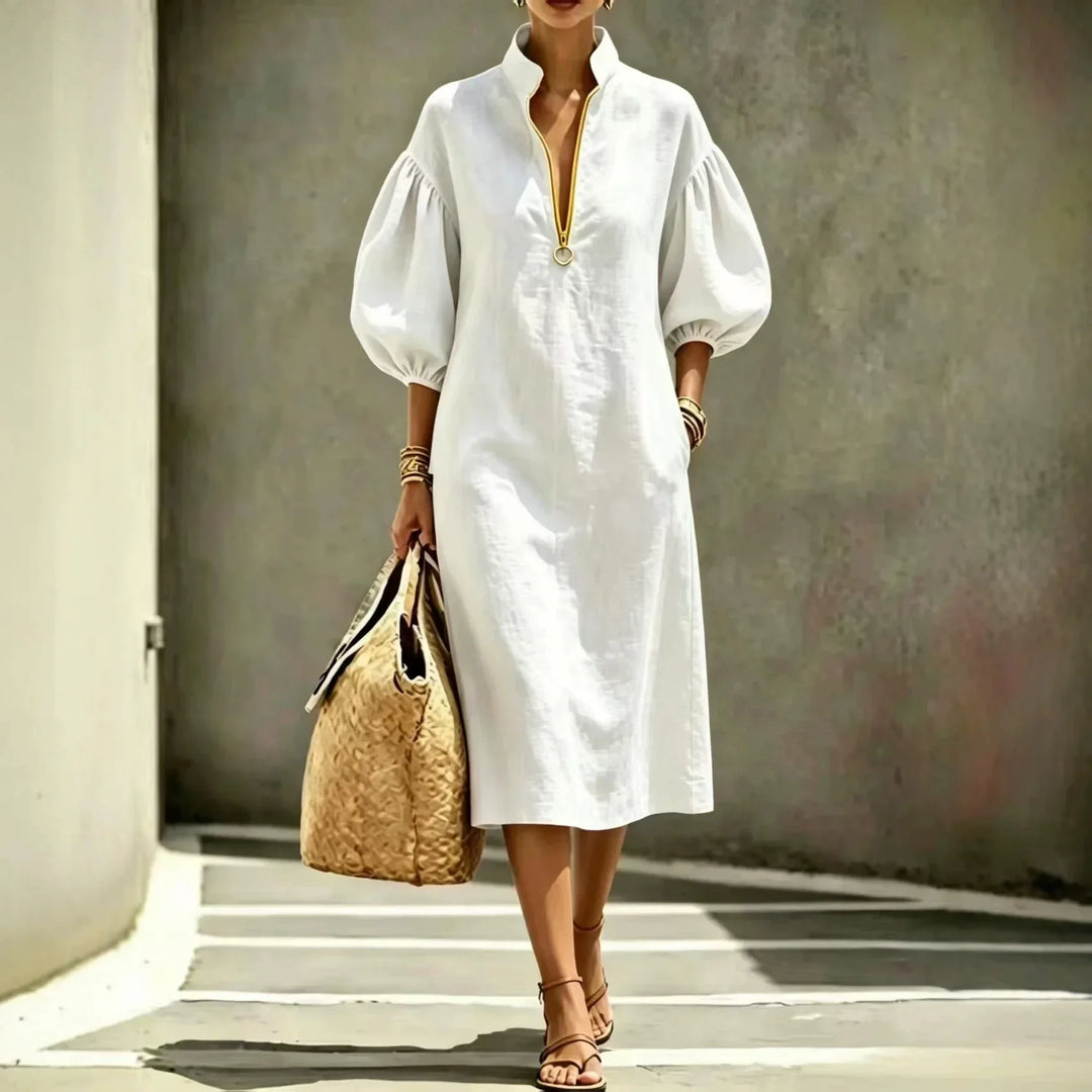 Relaxed fit spring/summer women's midi dress. Casual, chic, with a half-zip and fashionable bubble sleeves.